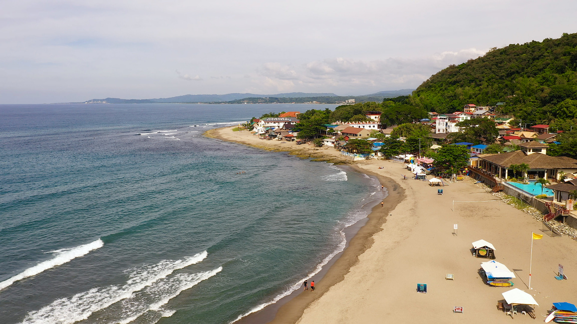 San Juan, La Union, Philippines. Sea coast with beach and hotels, top view